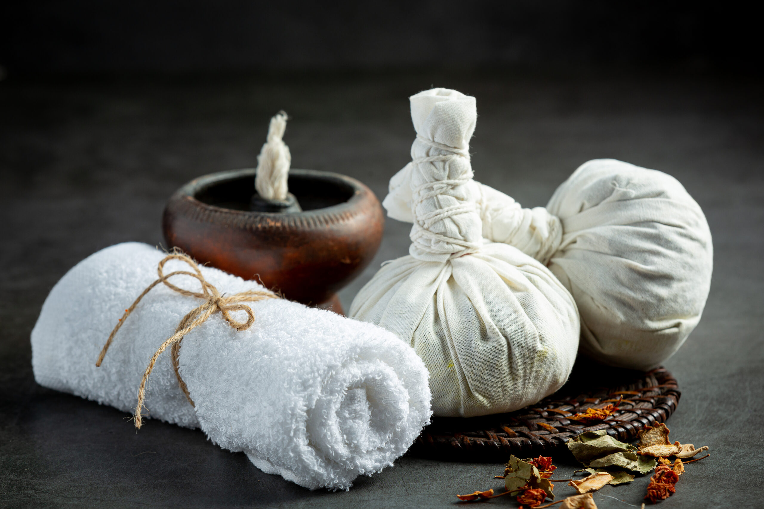 Herbal compress and herbal spa treatment equipments put on dark